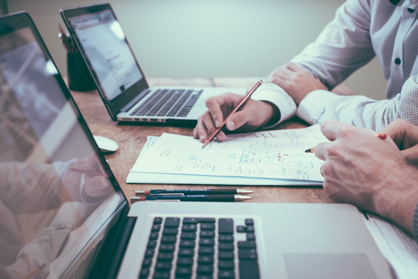 Person reviewing financial documents at a desk